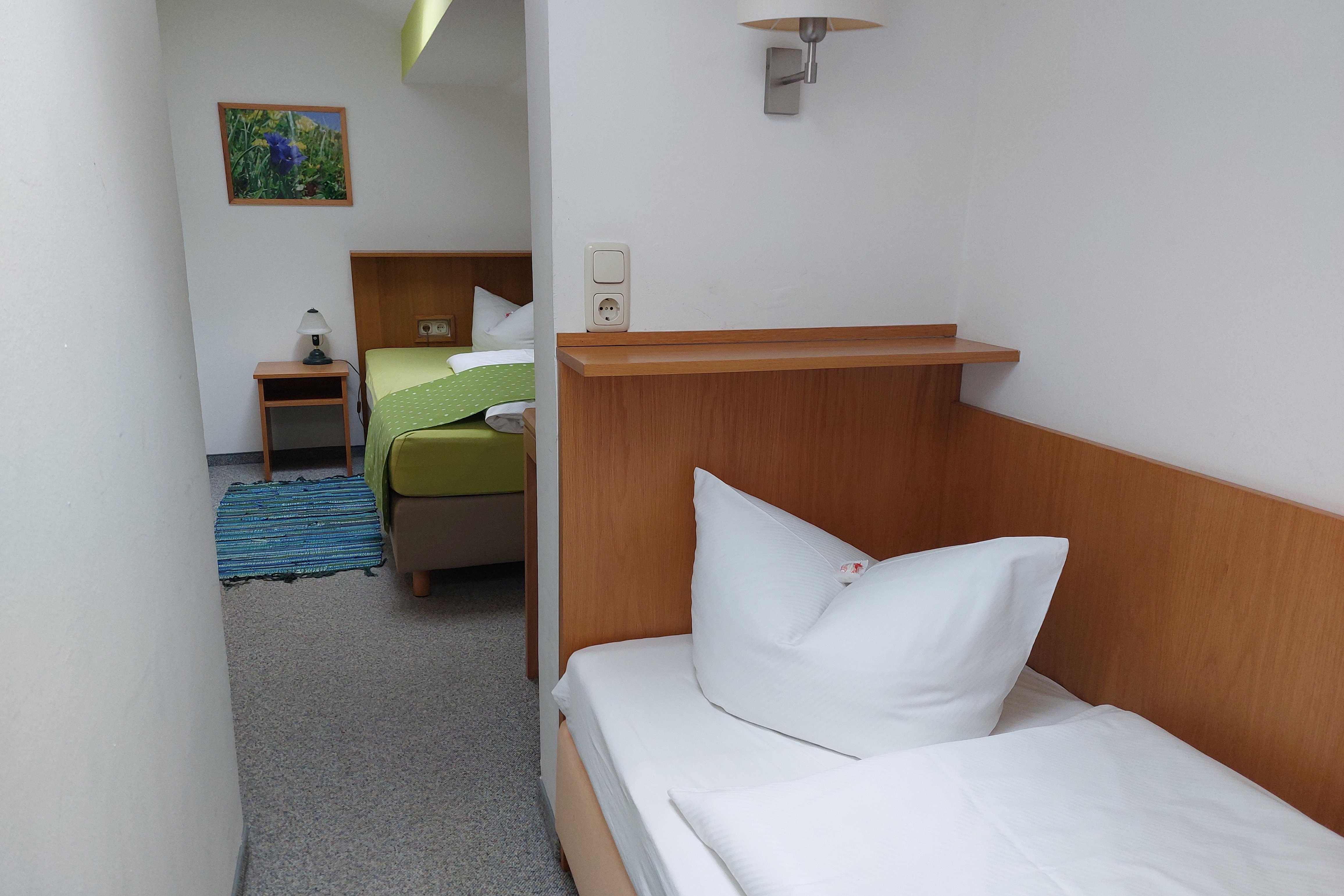 Der Schlafbereich in einer Ferienwohnung im Martha-Maria-Hotel Hohenschwangau.