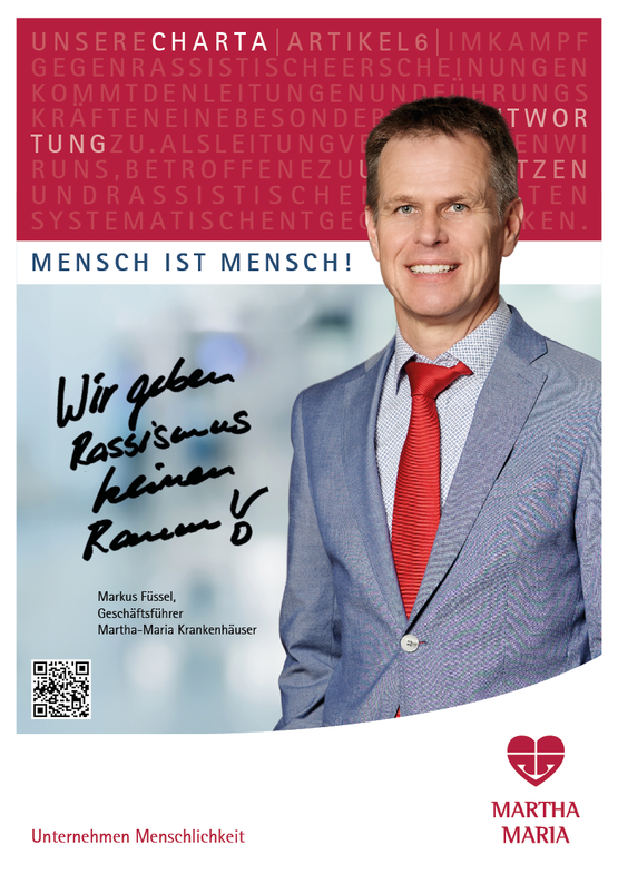 Mann im Anzug, Text: Wir geben Rassismus keinen Raum.